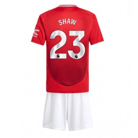 Manchester United Luke Shaw #23 Hjemme skjorte til barn 2024-25 Kortermet (+ korte bukser)